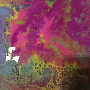 Black light neon acrylic pour painting.